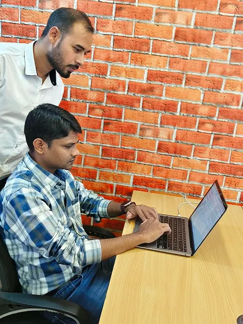 ImmensoTech developers collaborating while building and reviewing software applications