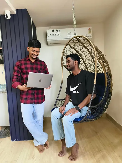 ImmensoTech team members collaborating on a laptop in the office